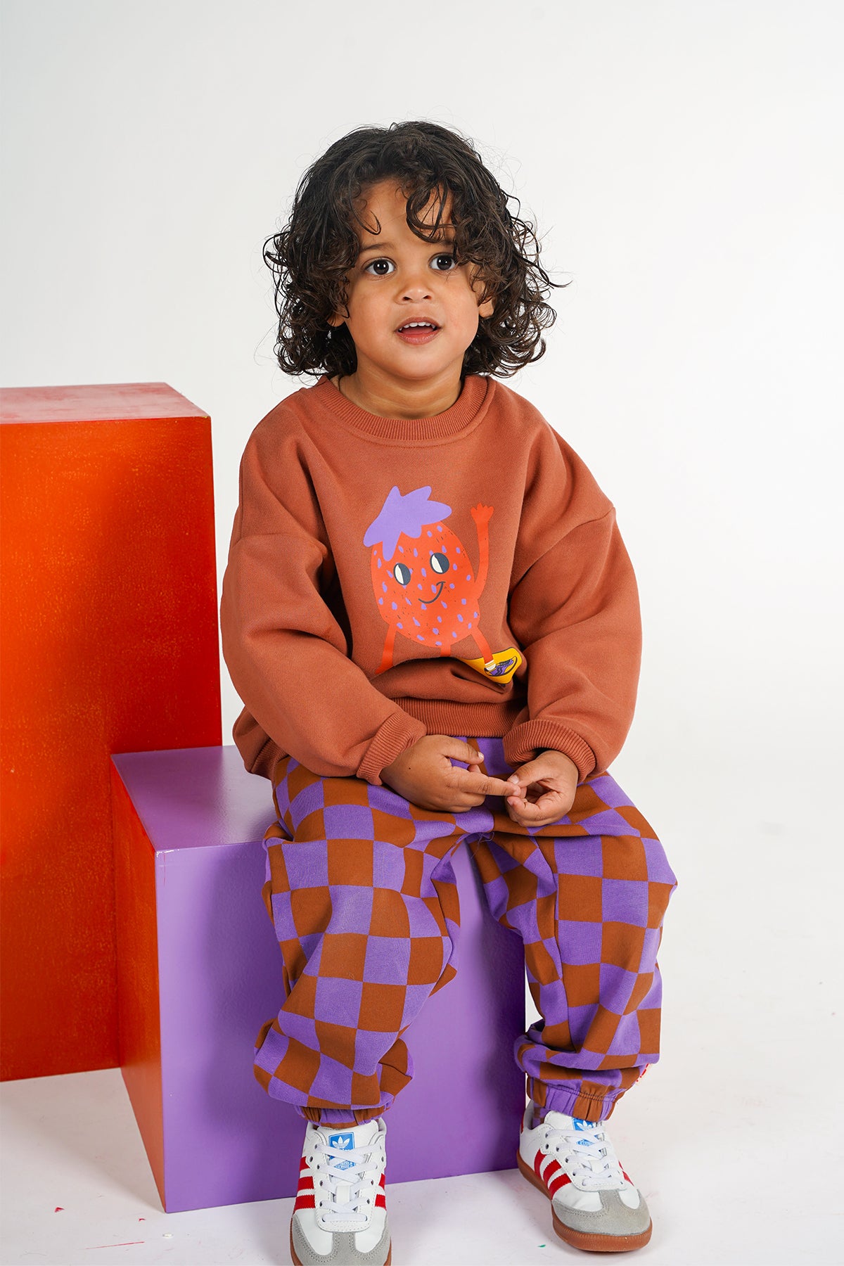 Wolf kinderjoggingbroek met oranje paars ruitpatroon van The New Chapter