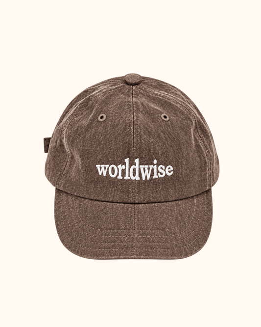 Brown washed cap with lettering on the front