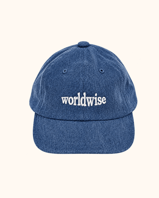 Navy washed cap with lettering on the front