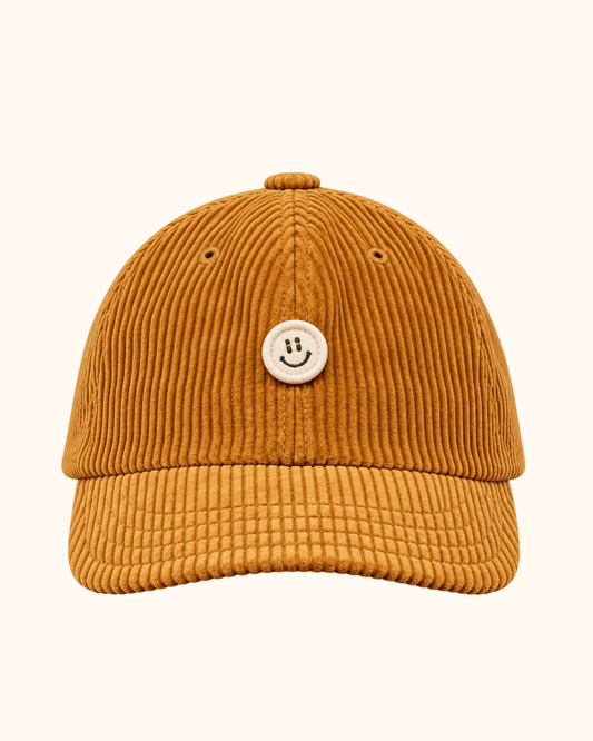 Beige corduroy cap with a small smile detail