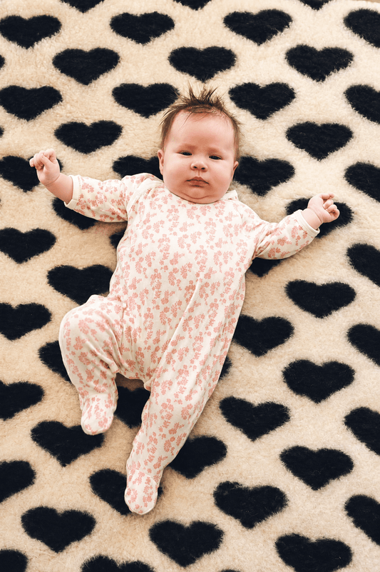 Baby wool liner by We Are Wovens in black with hearts