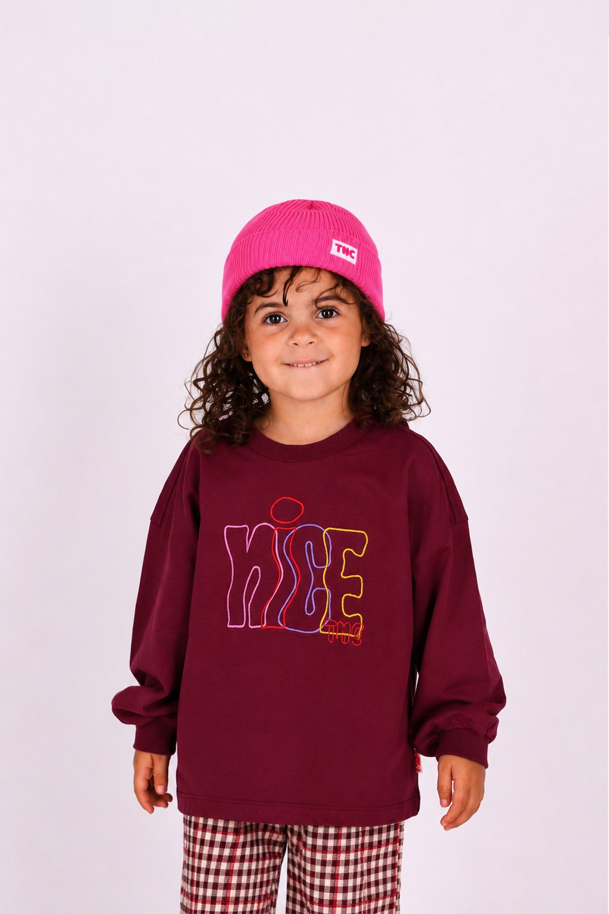 Child wearing pink Jip Beanie Rosebloom by The New Chapter