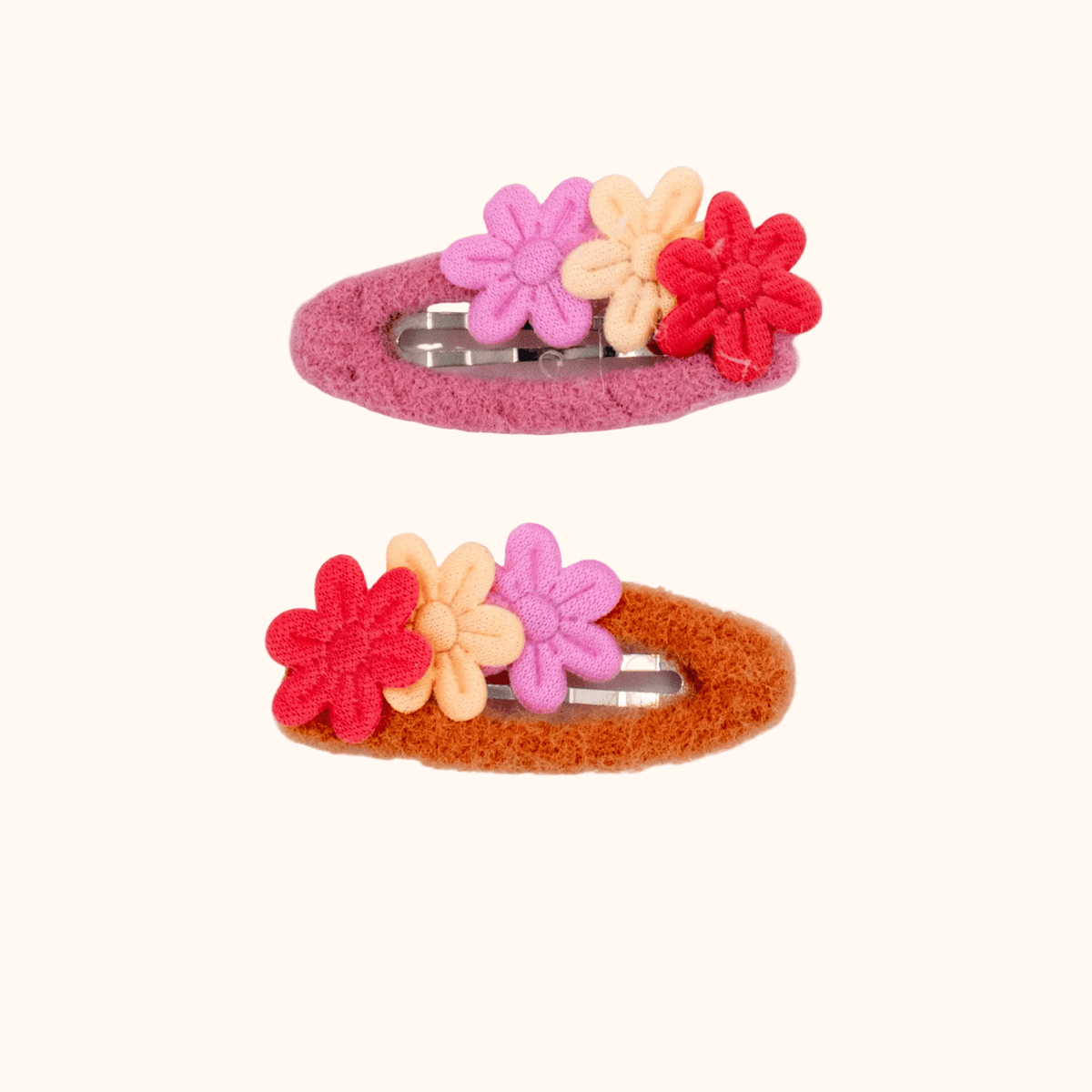 Hair clips by Colori Ribelle in pink and red and cream with flowers