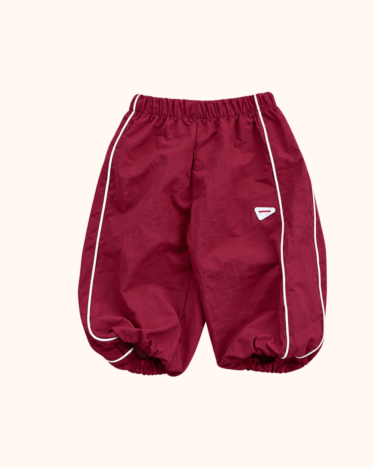 Burgundy Berry kids track pants with white piping by Black Bean