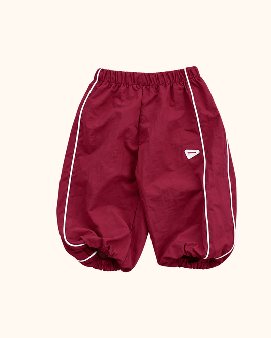 Burgundy Berry kids track pants with white piping by Black Bean