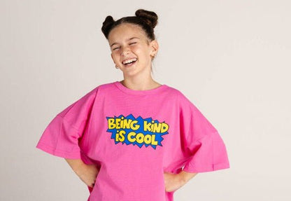 Being Kind Is Cool T shirt by BBOBBIE in pink, worn