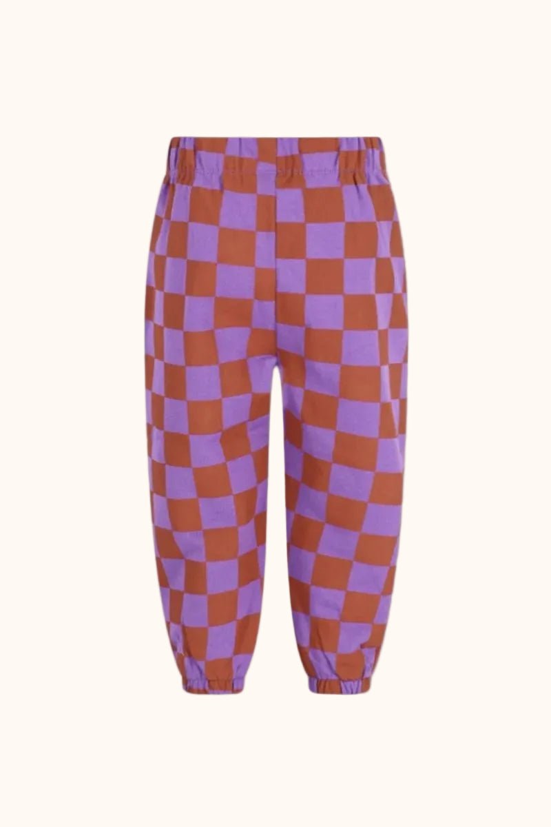 The New Chapter Wolf Sweatpants Checker in Orange en Lila